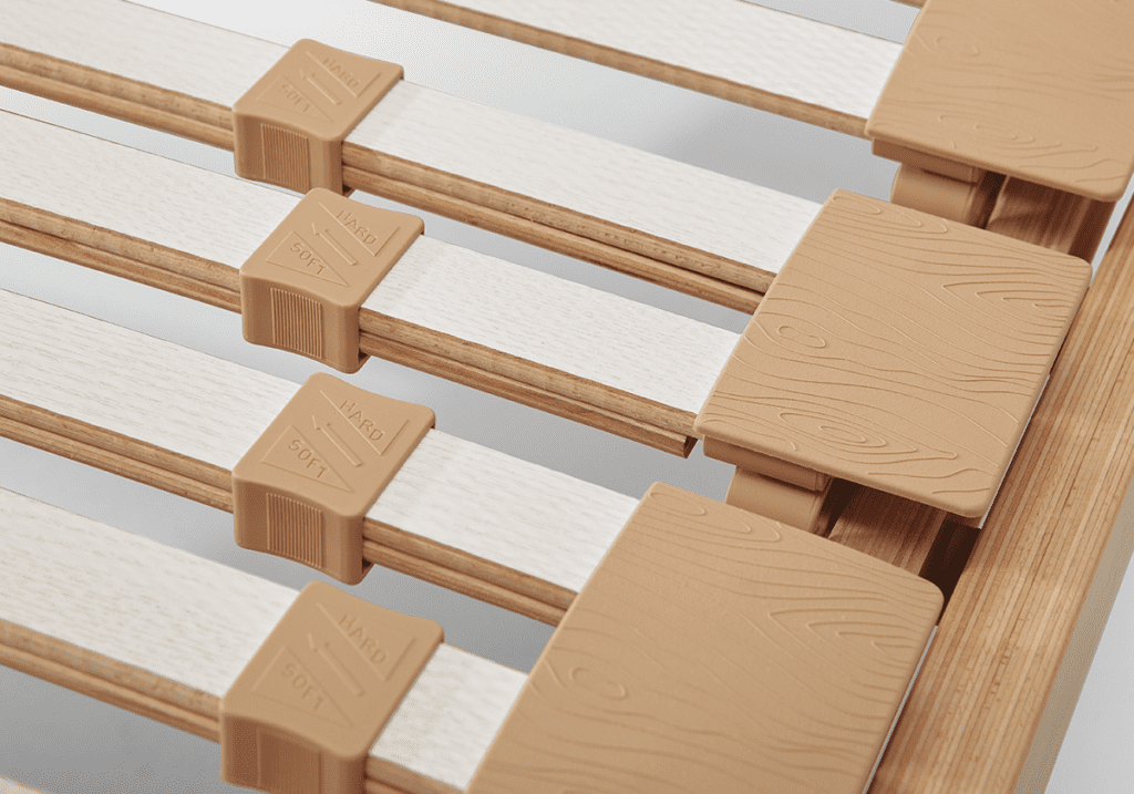 Close-up of an adjustable bed's slat system, demonstrating the range of customizable positions.